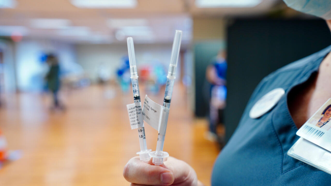 Medical Professional Holding Up Two non-specific medical devices