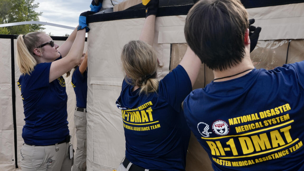 Emergency Responders Affixing a Temporary Barrier
