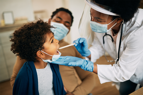 Doctor with patient and parent exam room