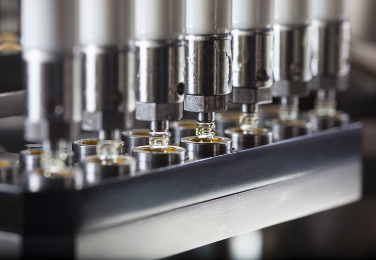 Yellow pills on a manufacturing rack