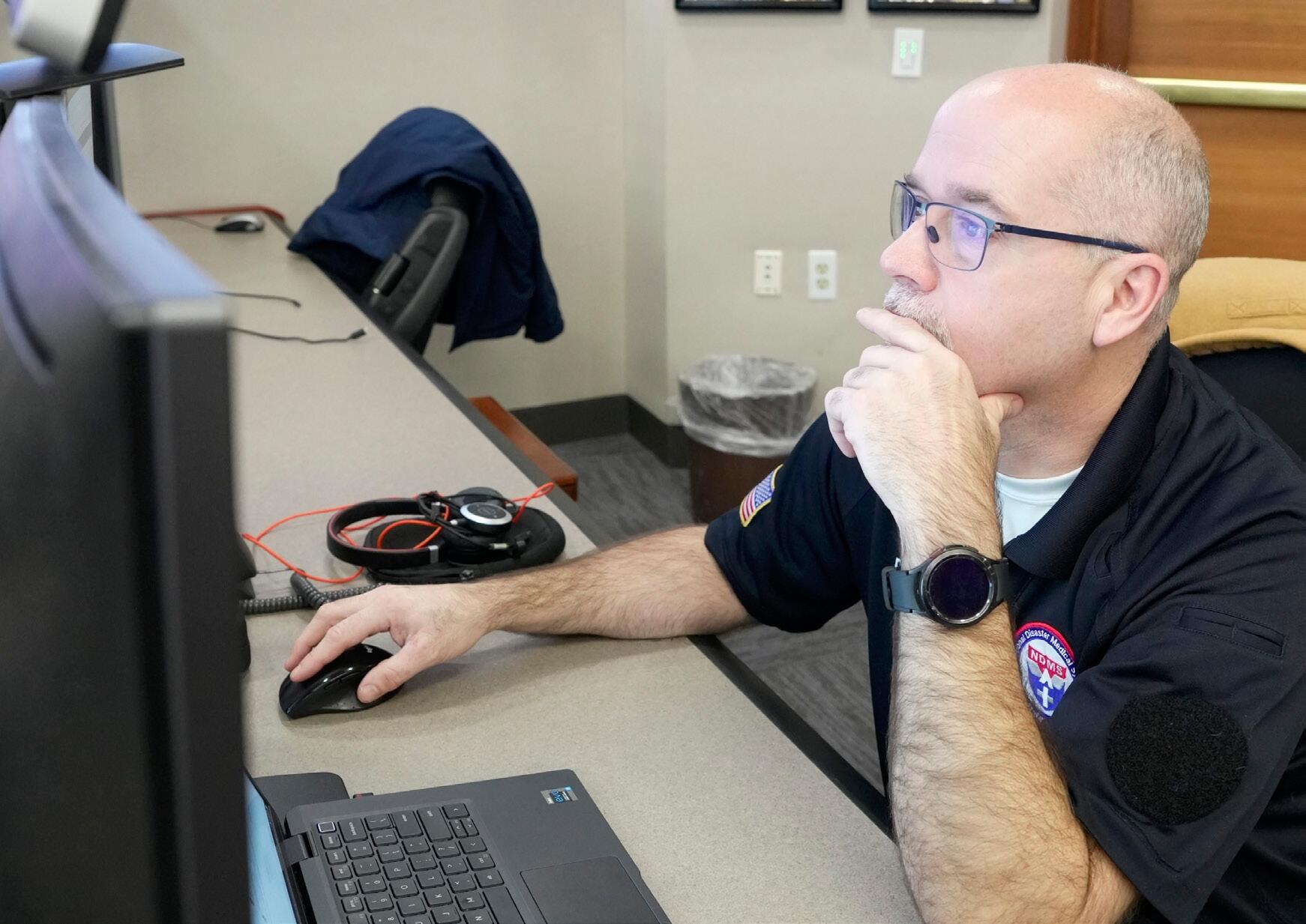 man reads from computer screen