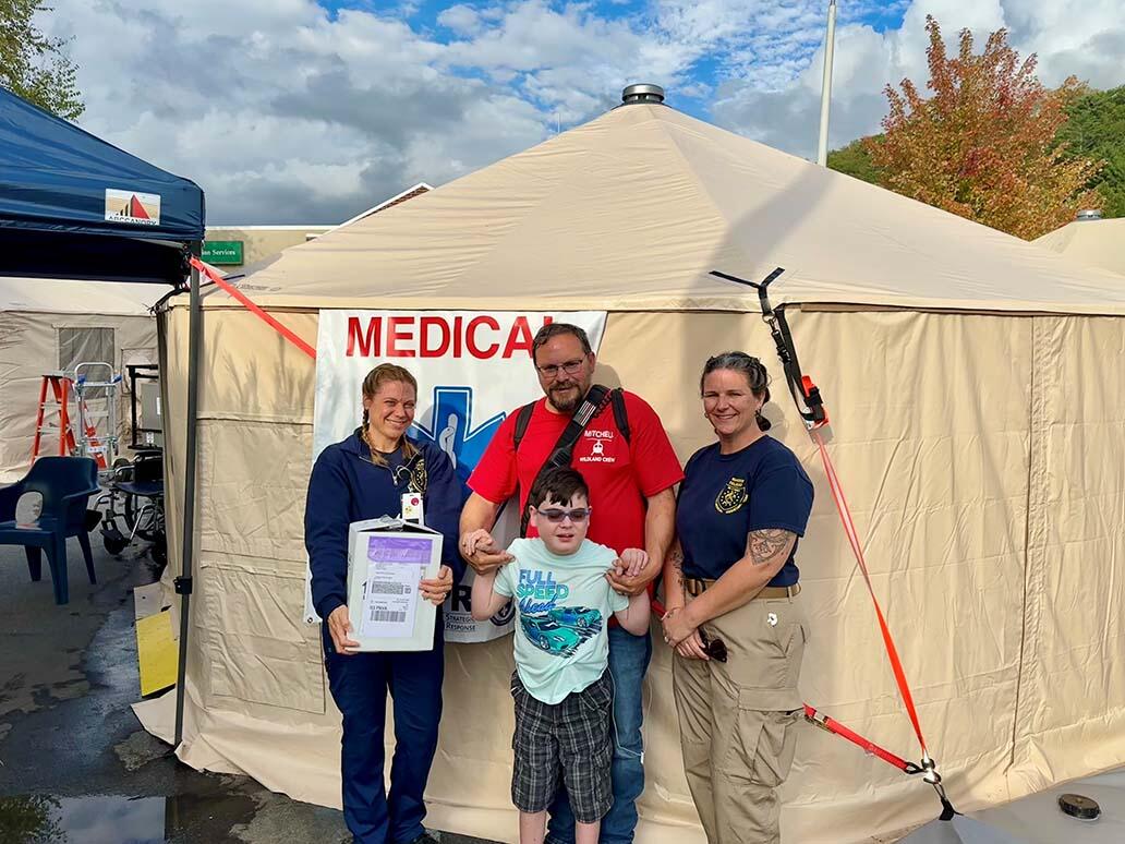ASPR's Jennifer Sawicky and Lindsey Corrente help 12-year-old Gabriel Pitman get life-saving medication difficult to obtain after Hurricane Helene.