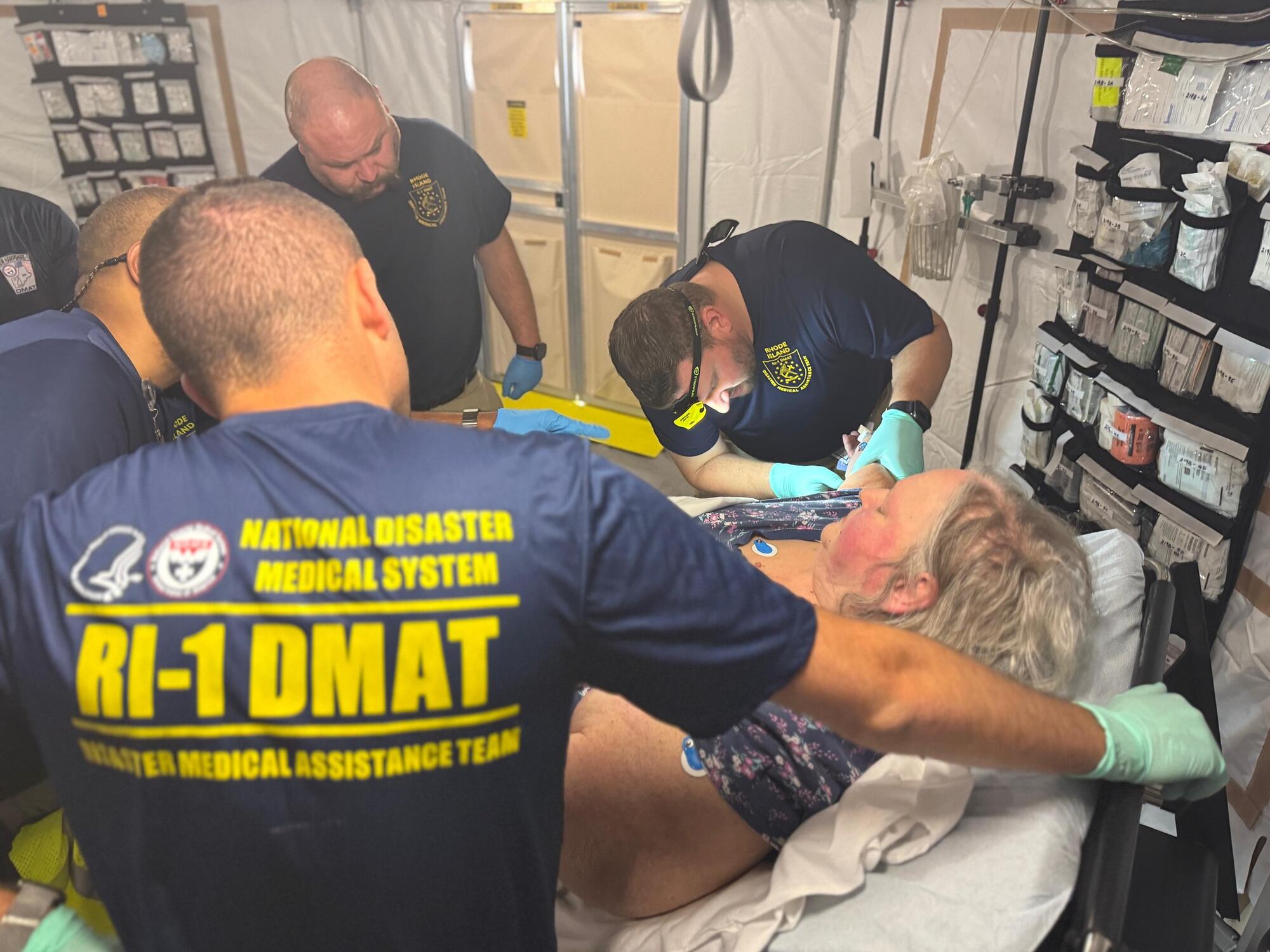 DMAT team members treat patient