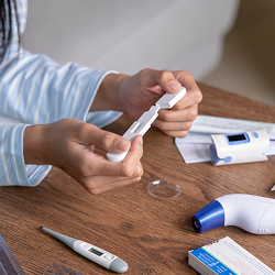 Medical Professional Looking at a Device