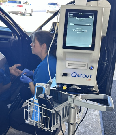 Medical professional assisting patient in car