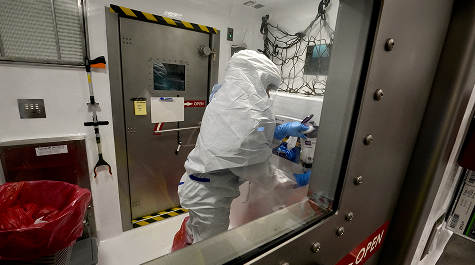 Person working in a Hazardous Material Protection Suit