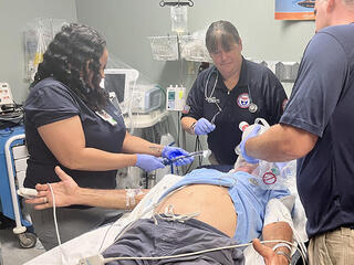 NDMS team treat an elderly patient in the ER