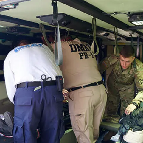 NDMS team working on a patient  on an ambulance
