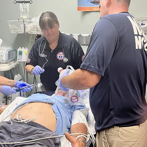 NDMS team treat an elderly patient in the ER