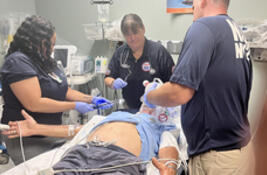 NDMS team treat an elderly patient in the ER